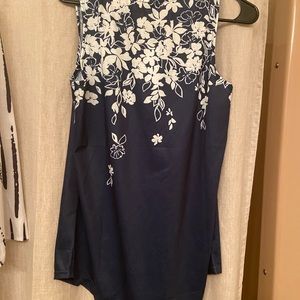 Polyester top. Tags on. Never worn size medium.